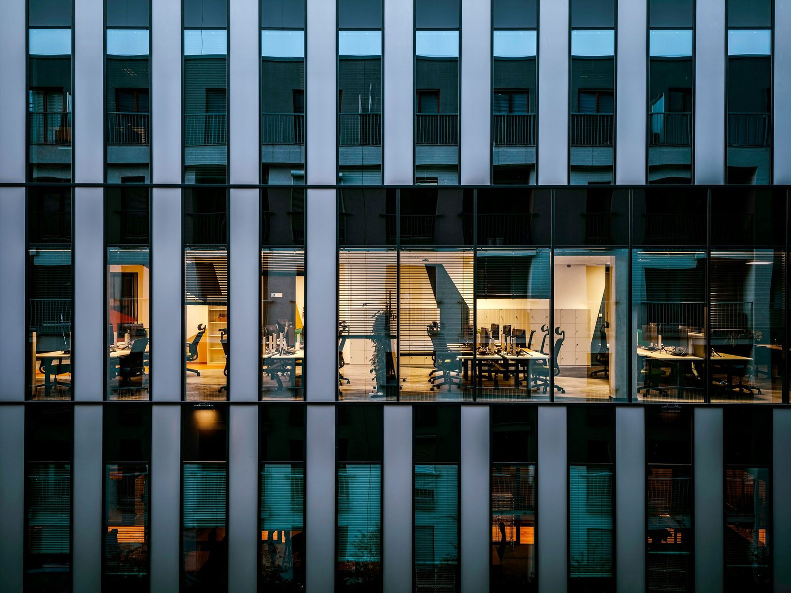 Modern office building facade at dusk